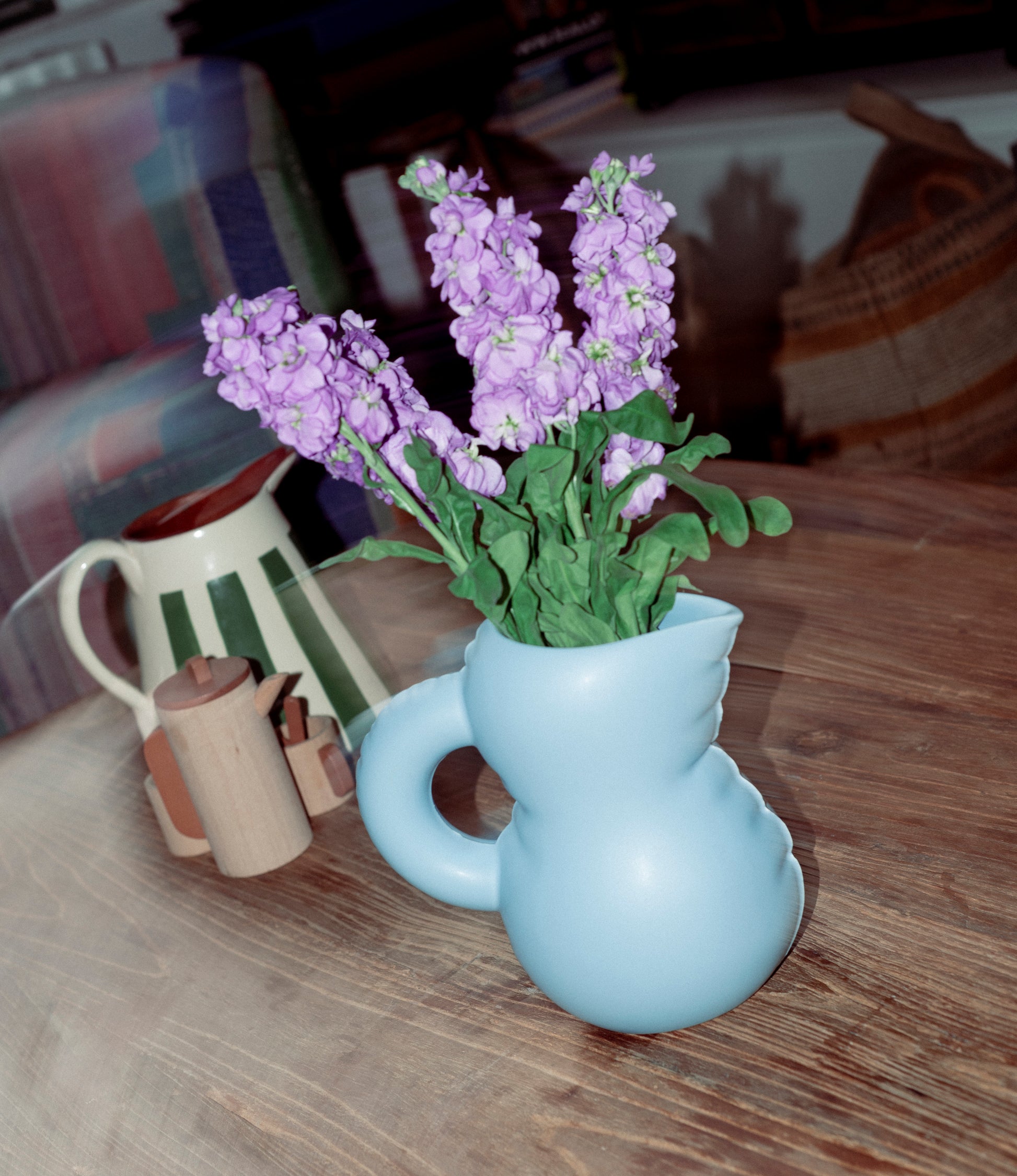 Emily Jug from Home Studyo holding a bouquet of lilac flowers.