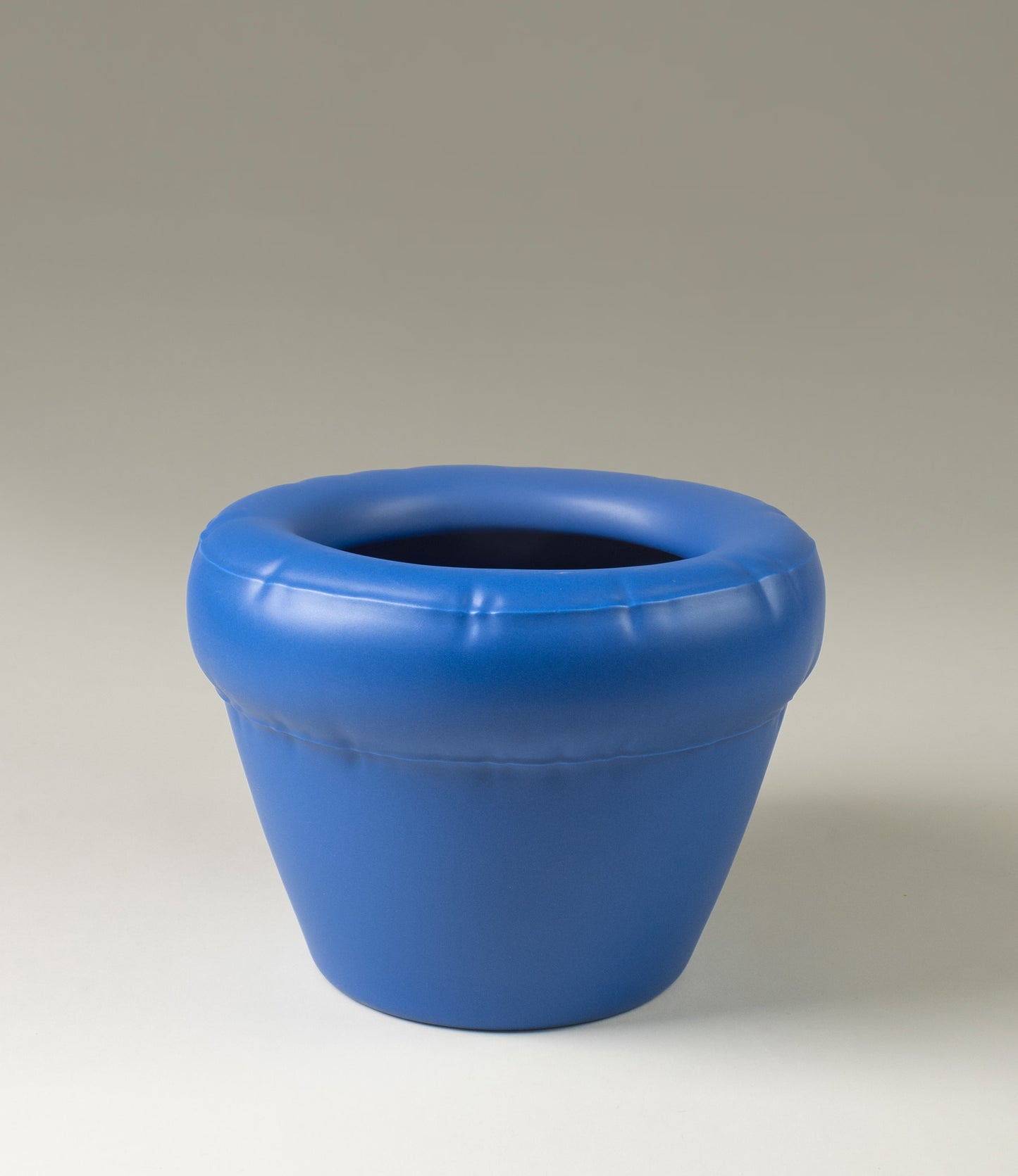 Pierre planter from HomeStudyo handwashed in the color indigo. The piece looks like an inflated balloon but was made from a sturdy material, ceramic. An unexpected paring of design and material, handmade in Portugal.