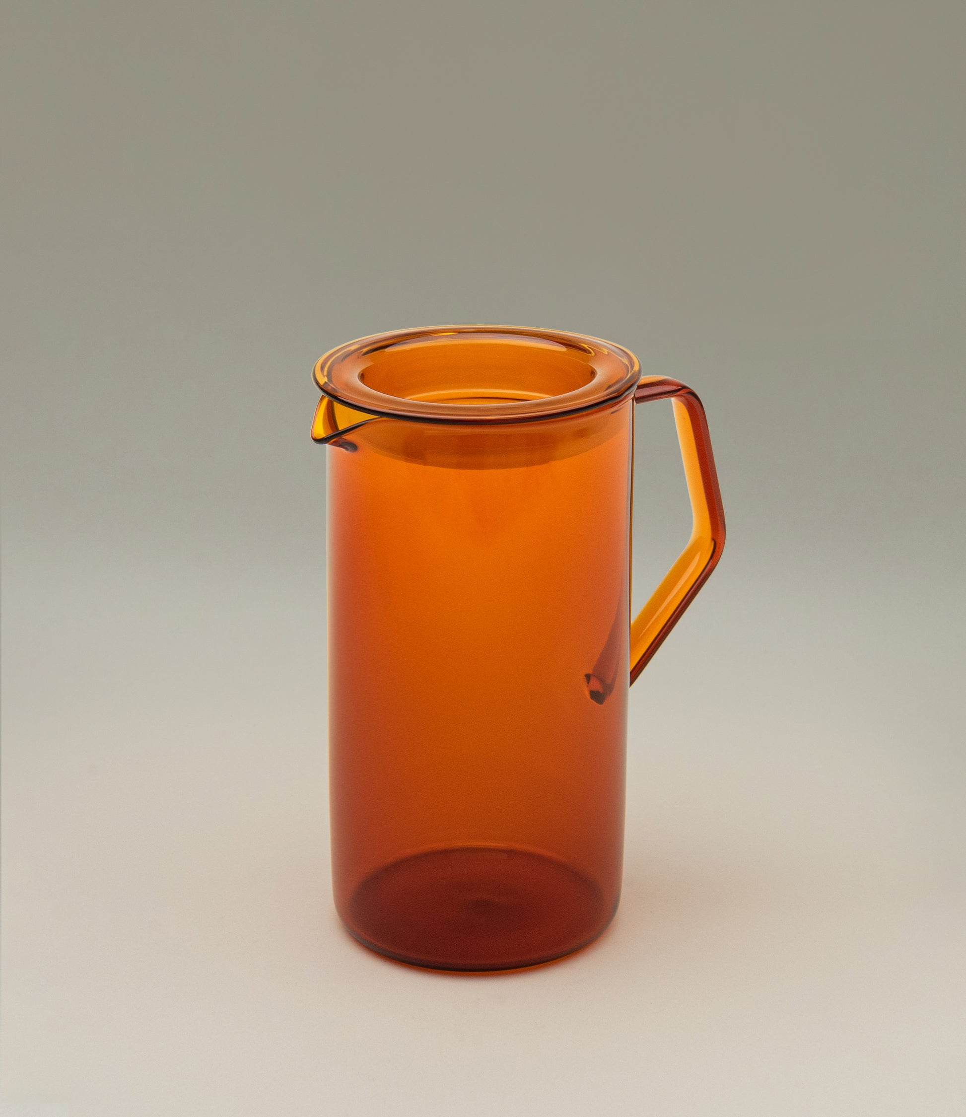 Cast Amber Jug from Kinto. The Item can hold 750ml of liquid. The modern geometric shape is a perfect companion to any kitchen.