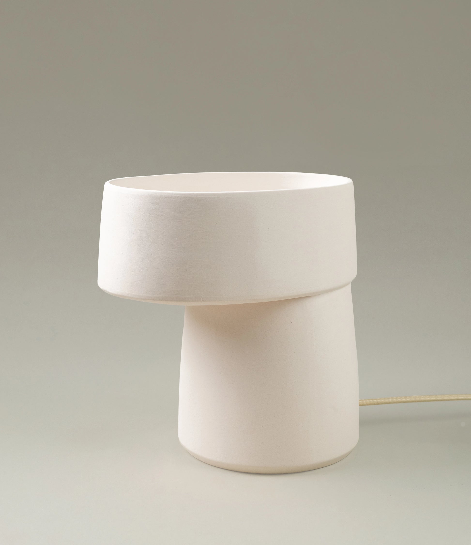 Rome lamp from Serax is a minimal design. The color of the item is off white and has rounded edges. 